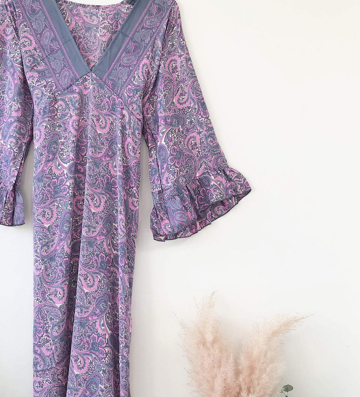 Bluebell lilac vintage-silk free-size ruffled-sleeved tie maxi dress with intricate paisley pattern and soft flowing fabric displayed against a white background with dried pampas grass.