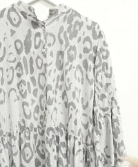 Light grey and white Paloma animal-print boho midi smock dress free-size with button closure and relaxed, flowing fabric, showcasing a soft bohemian style.