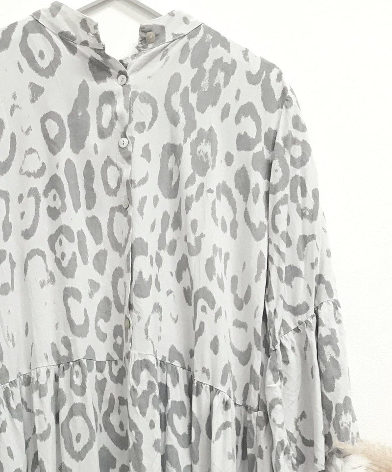 Light grey and white Paloma animal-print boho midi smock dress free-size with button closure and relaxed, flowing fabric, showcasing a soft bohemian style.