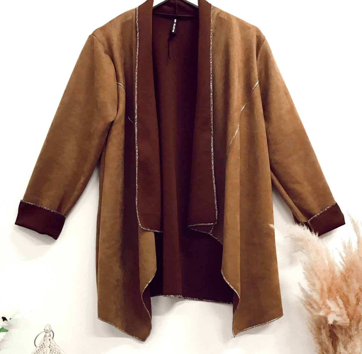 Faux-suede boho waterfall tan jacket with an open front and relaxed fit, featuring soft fabric and bohemian style perfect for layering in casual outfits.
